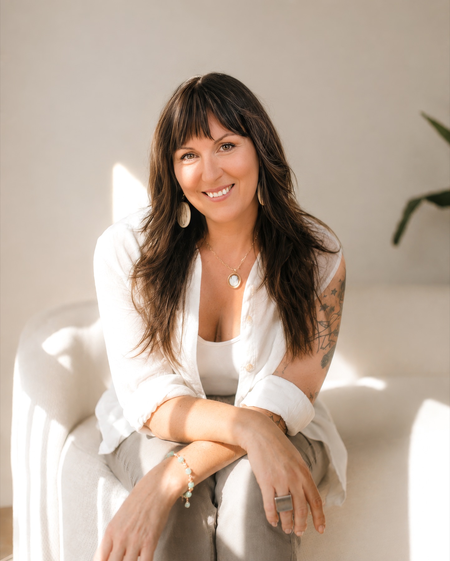 Erica Greye, founder of Restorative Living, seated in a naturally lit room